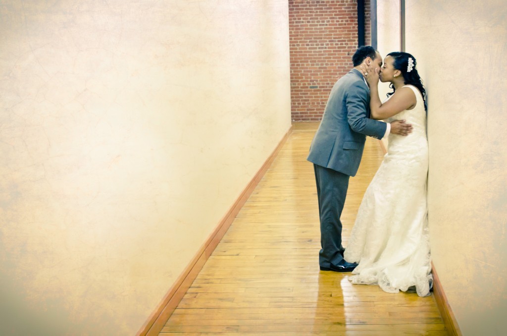 Bride and Groom kiss, Charlotte NC Wedding Reception Photography, Design Center of The Carolinas