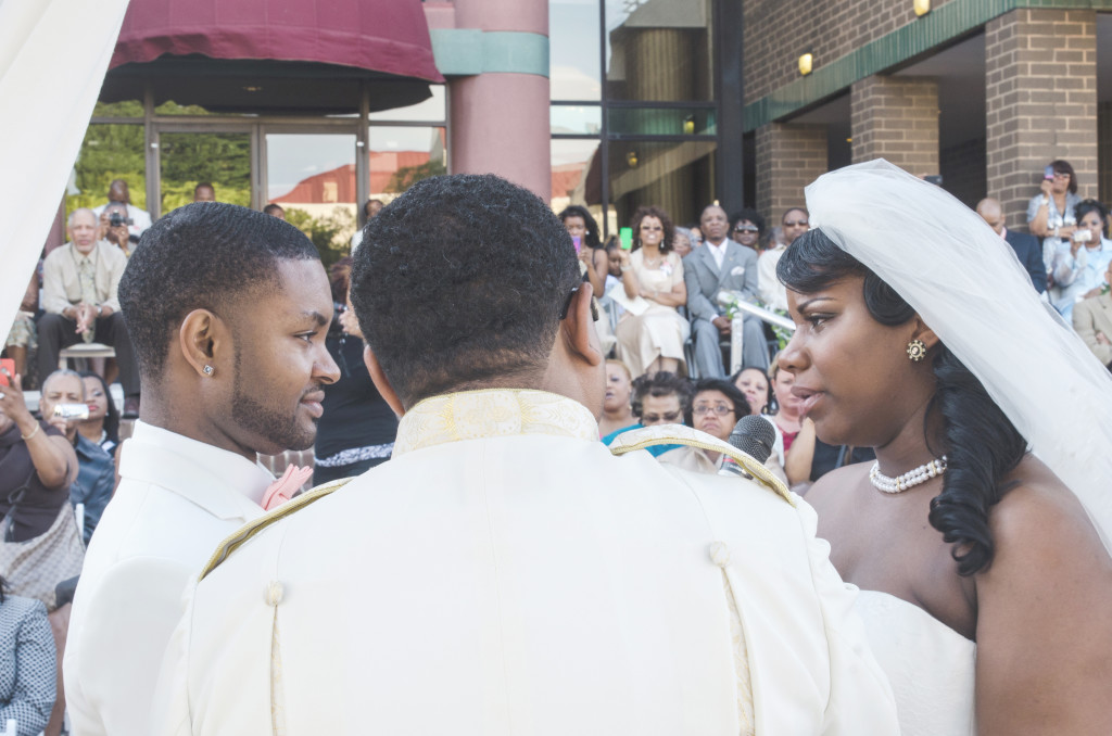 Groom, Minister, Bride and guests at their wedding ceremony