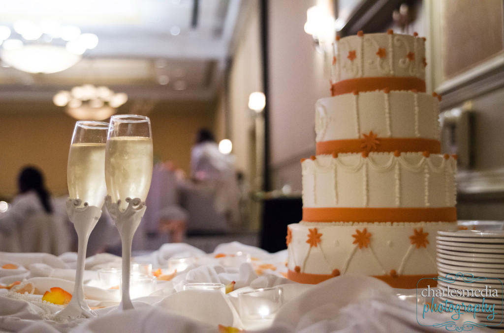 reception image with bride and groom's champagne and wedding cake