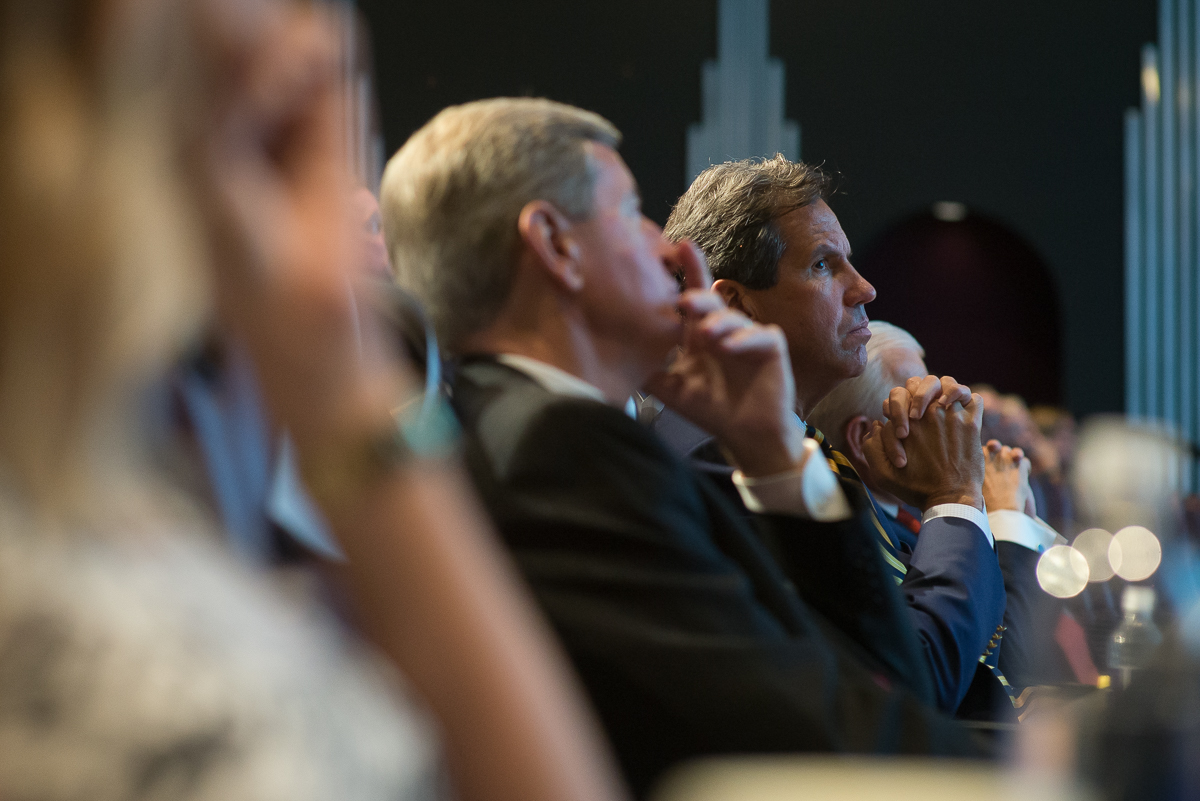 Kelly King, Stan Kelly sit with High Point University President Nido Qubein at the Piedmont Triad Partnership's "State of the Region" address