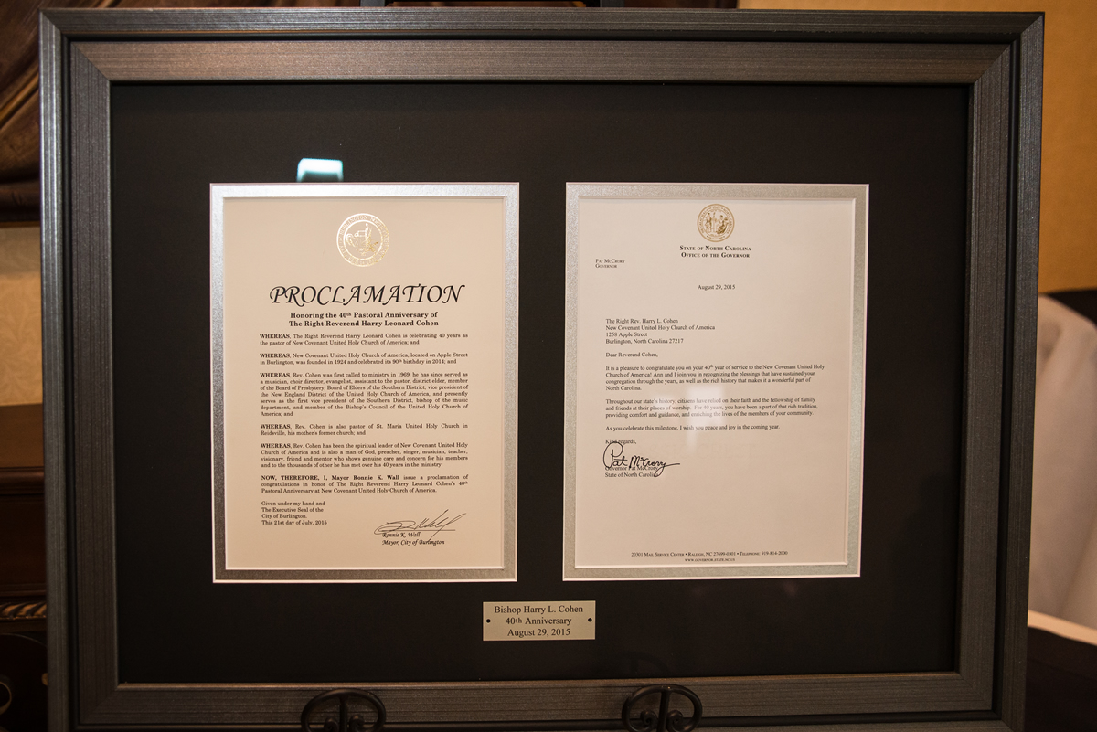 Display case showing proclamations from the Mayor of Burlington, NC and the Governor of North Carolina celebrating Bishop Harry Cohen