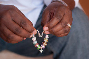 Charlotte North Carolina African American Maternity Photography Father Holding Bracelet