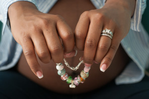 Charlotte North Carolina African American Maternity Photography Mother Holding Bracelet